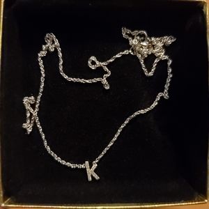 Silver K pendant with small diamonds